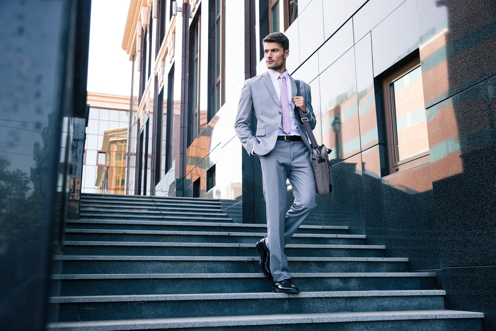 navy blue suit with champagne bow tie