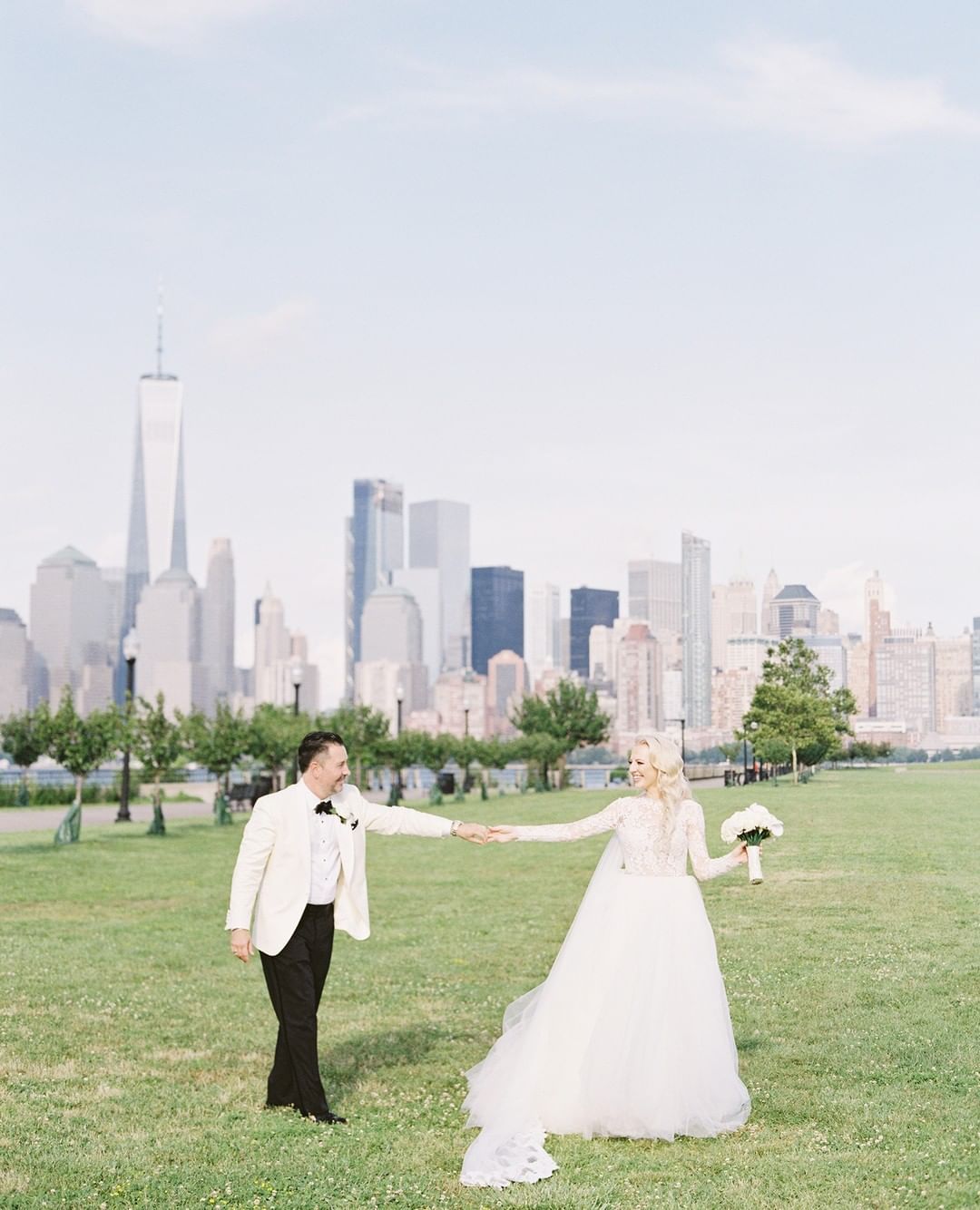 Bride and groom in front of NYC skyline